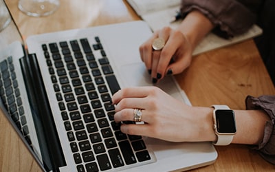 person typing on keyboard